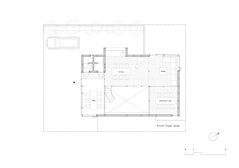 First floor plan drawing showing dining area, lounge, and central triangular void with carport to the left