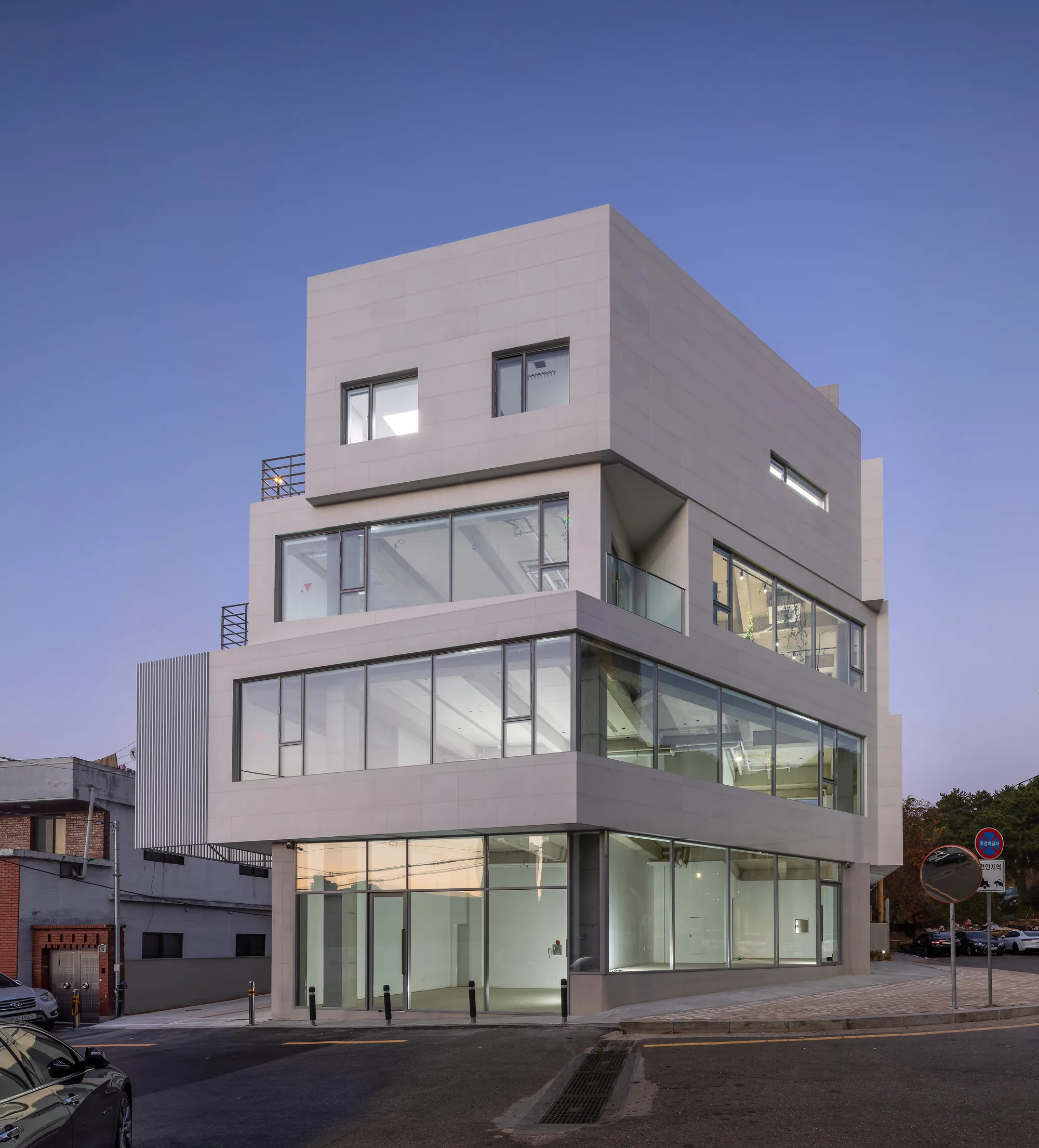 Architects Group RAUM Stacks Offset White Volumes into a Compact Office Tower in Busan