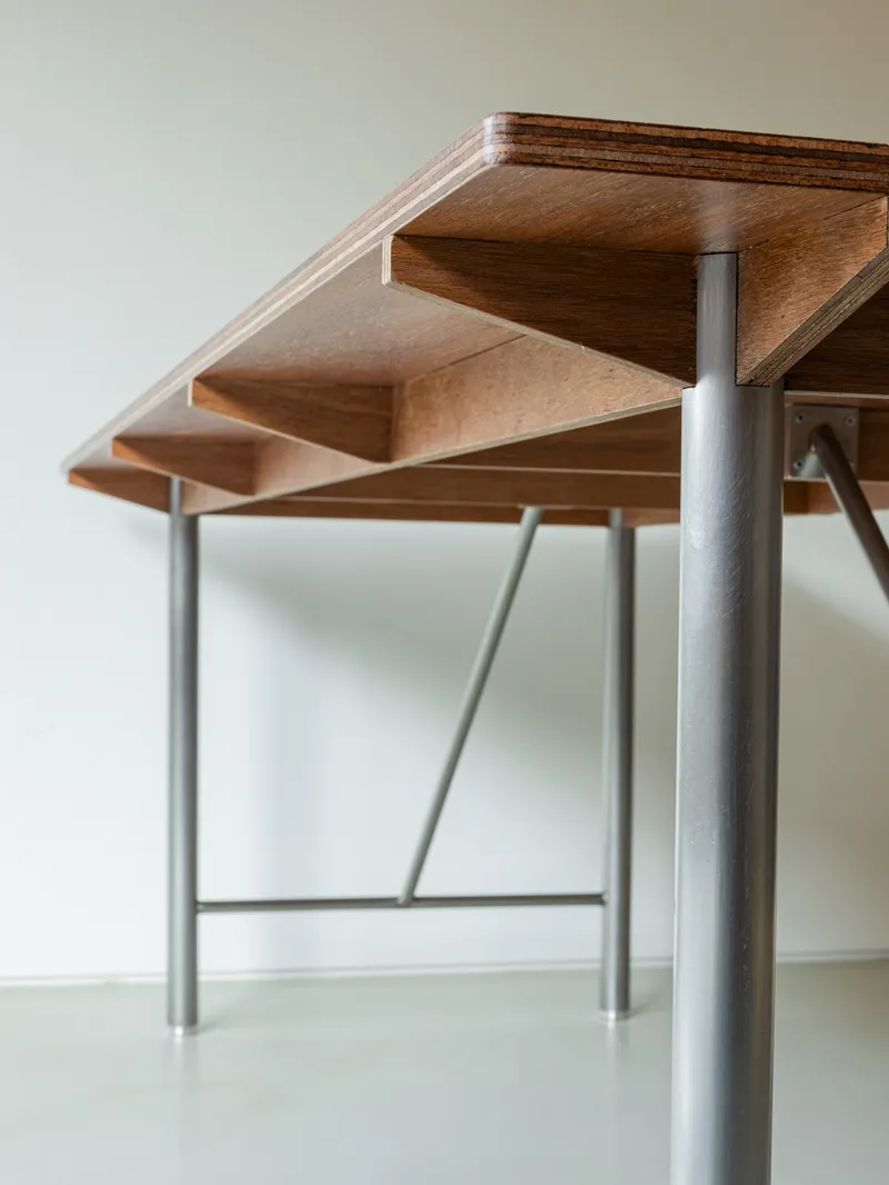 Detail of laminated timber treads supported by steel tube columns and diagonal bracing rods