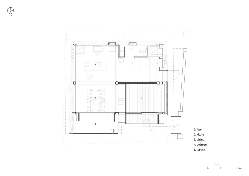 Floor plan drawing showing kitchen, dining, bedroom and terrace arranged around a central stair