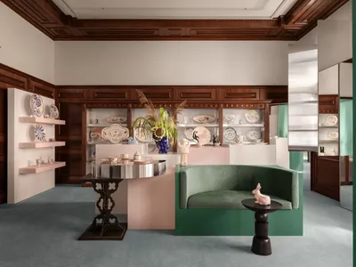 Temp Project Hides a VIP Fitting Room Inside a Mahogany Cabinet in This Kyiv Showroom