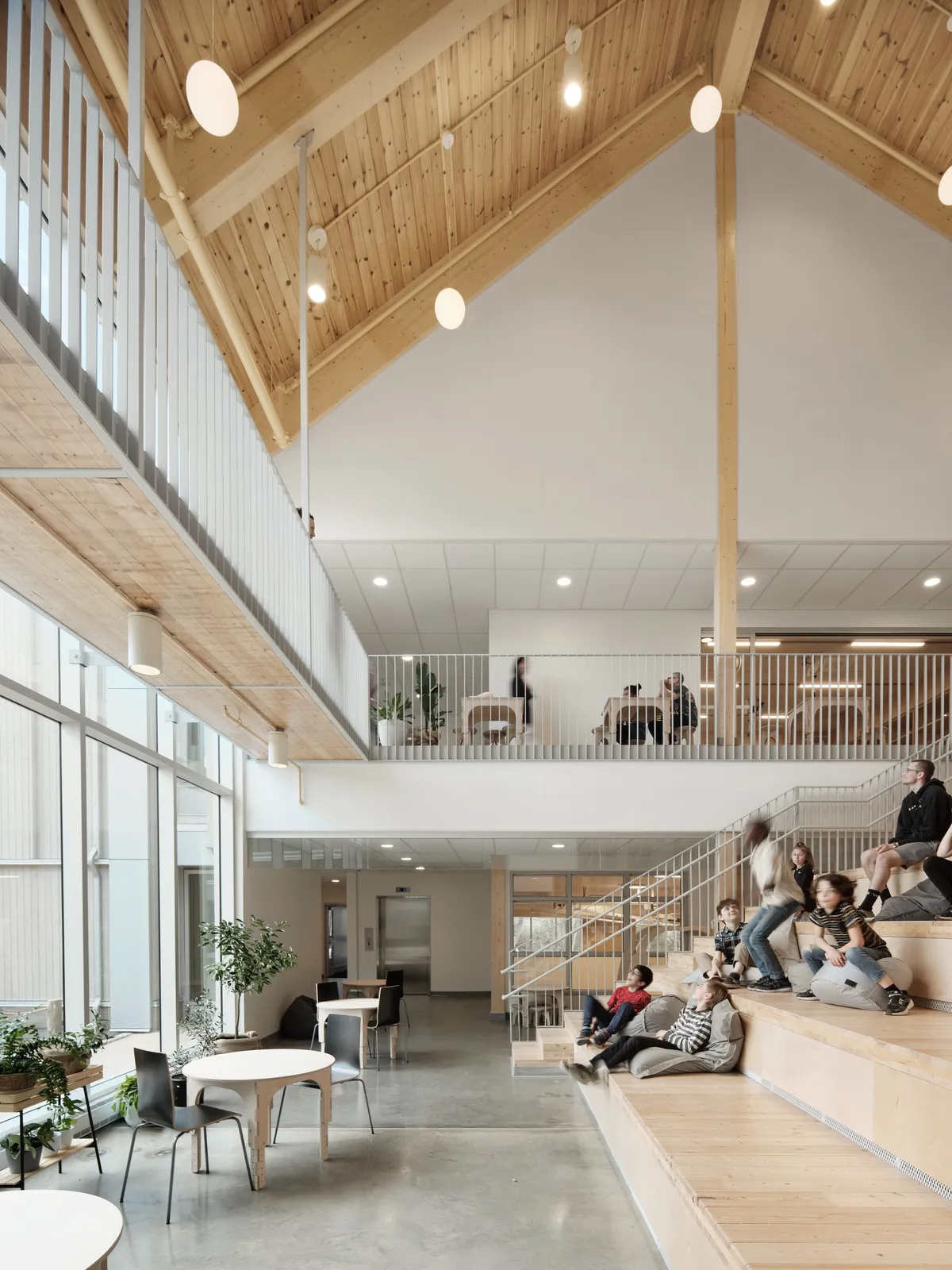 Agence Spatiale Clusters Timber Gables Around a Courtyard to Rethink the Saguenay School