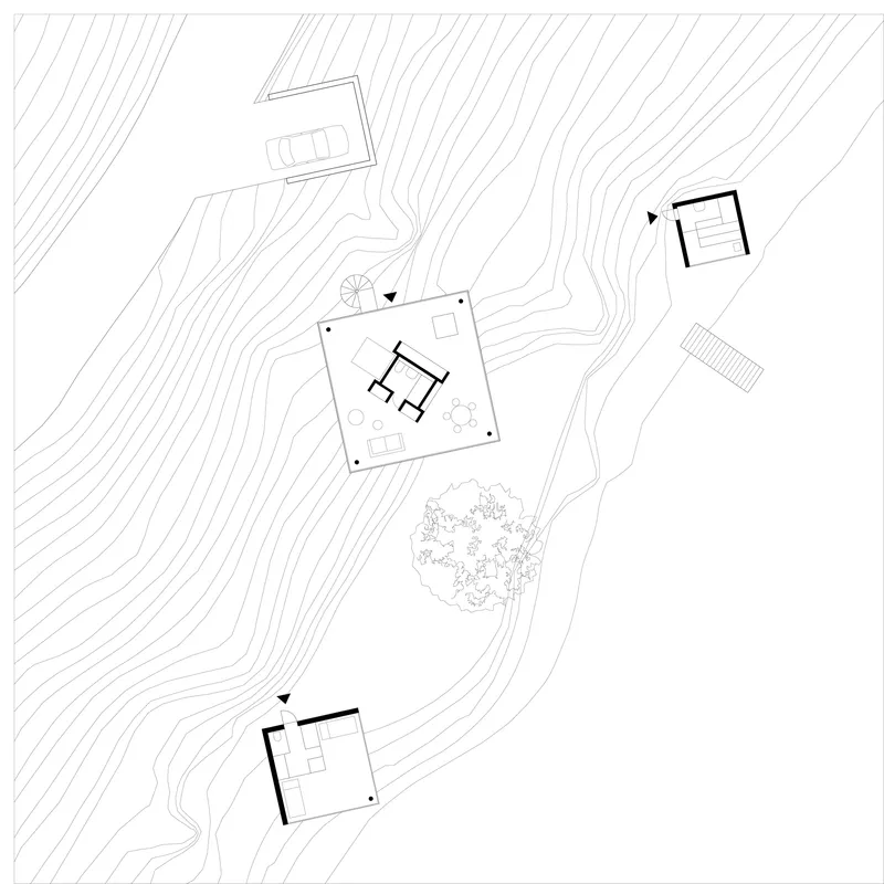 Site plan drawing showing three structures and contour lines across a sloping waterfront terrain