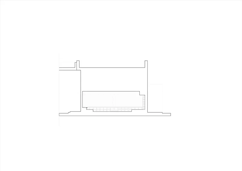 Section drawing revealing interior volume with stepped floor levels beneath flat roof plane