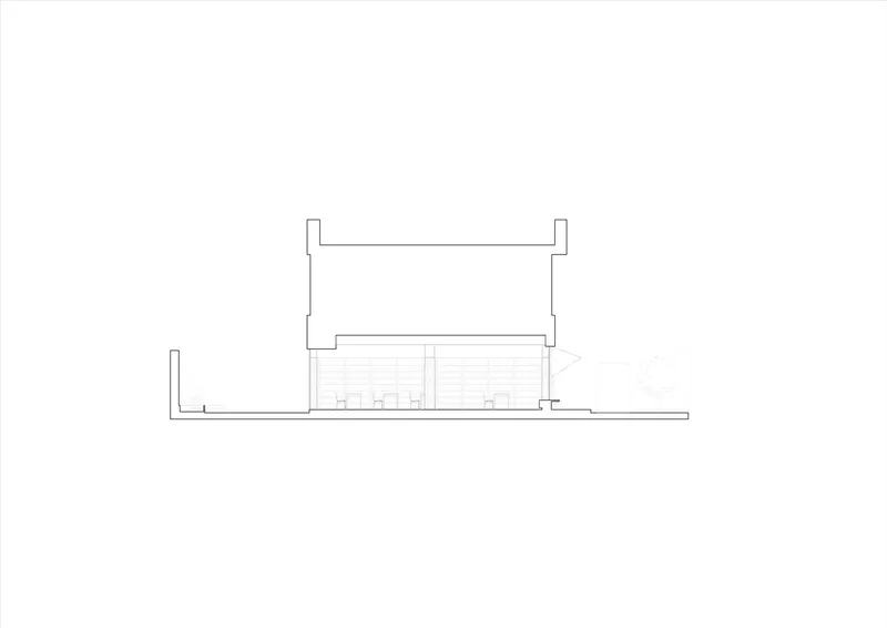 Section drawing showing a two-story volume with upper terrace and lower ground-level spaces