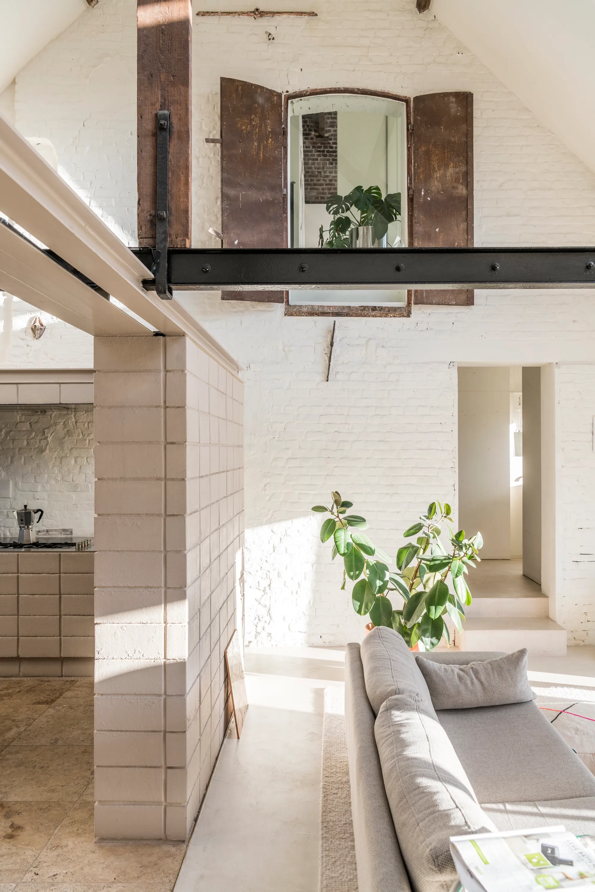 AUX Transforms a 19th Century Ghent Steam Brewery into a Home with a Rooftop Garden