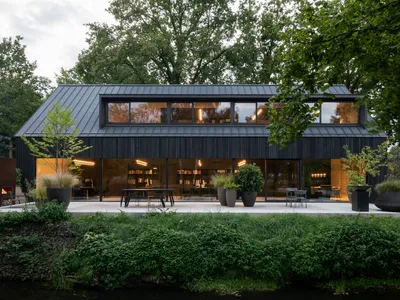 studio] [Space Builds a Black Barn Office That Disappears Behind the Dutch Landscape