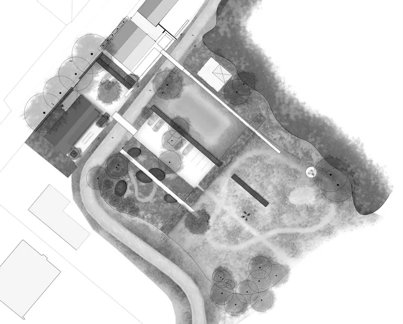 Site plan drawing showing building footprint surrounded by landscape and tree canopy circles