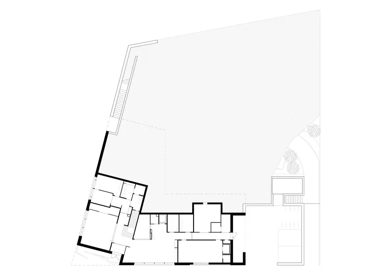 Ground floor plan drawing showing angled interior rooms and a large open courtyard area