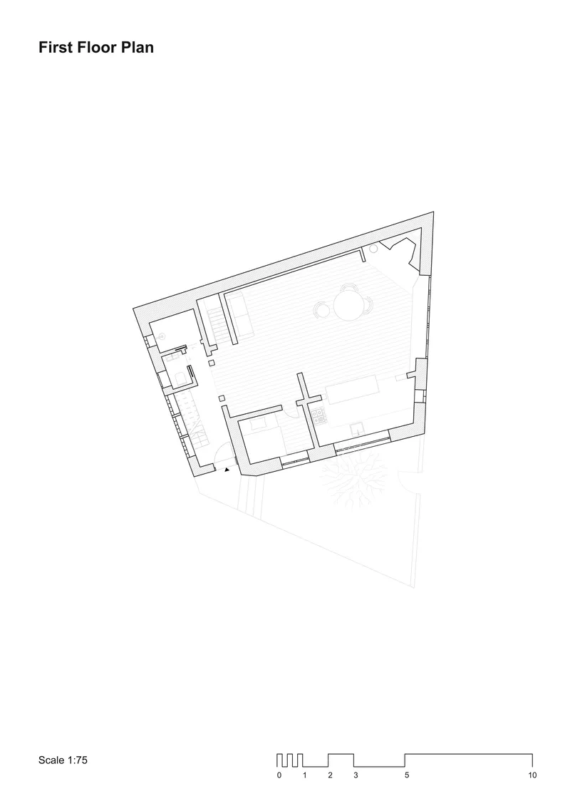 First floor plan drawing showing an open layout with separate service rooms along one edge