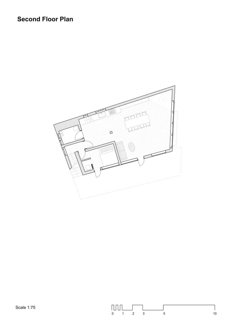 Second floor plan drawing showing an open space with kitchen and dining areas