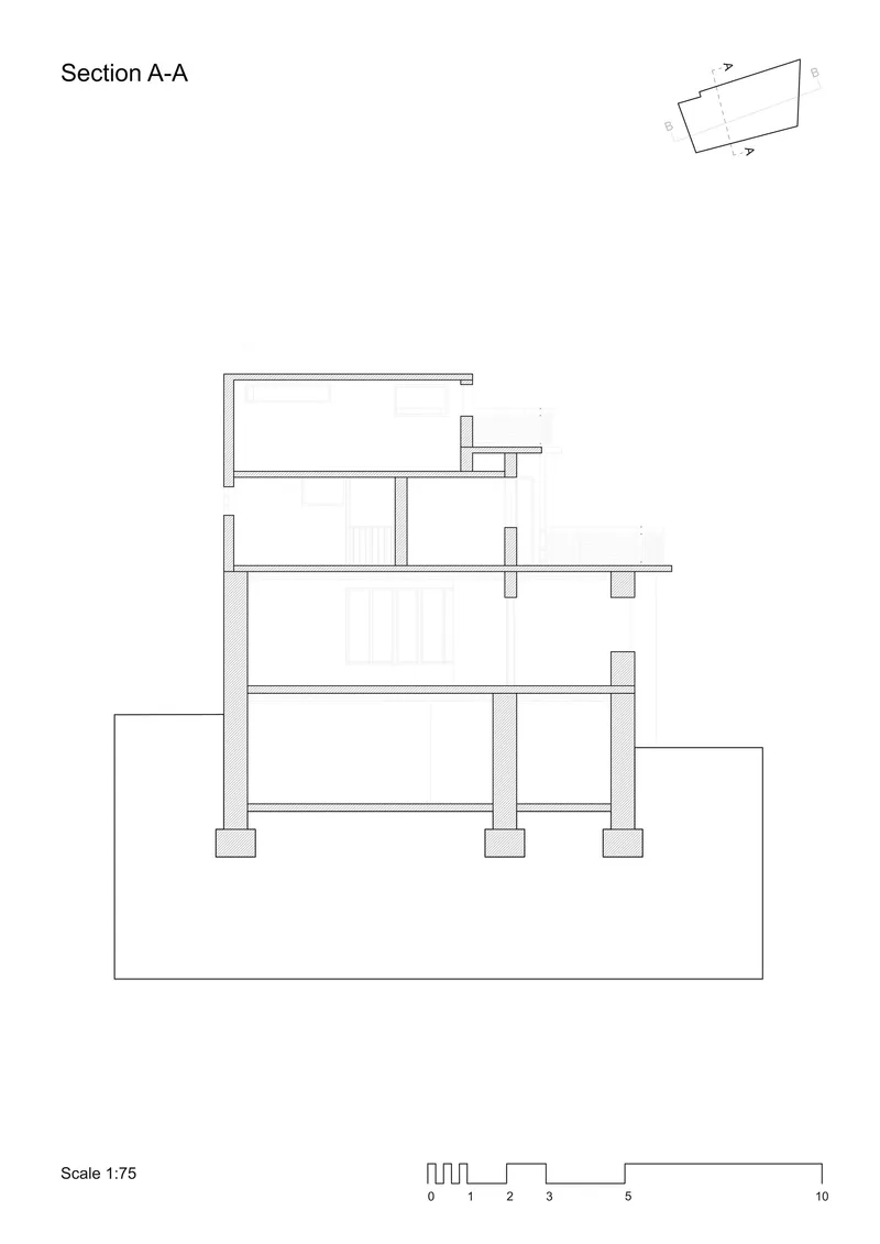 Section A-A drawing revealing three levels of interior spaces supported by columns with foundation below