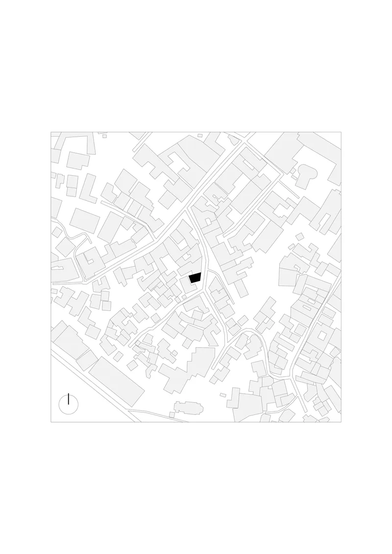 Site plan drawing showing the building footprint highlighted in black within the surrounding urban fabric