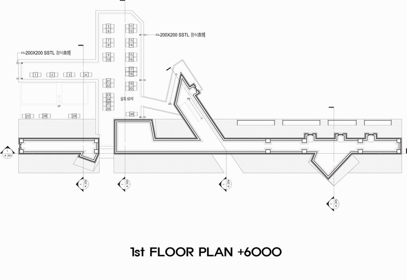First floor plan drawing showing angled volumes extending from a linear bar with exterior stairs