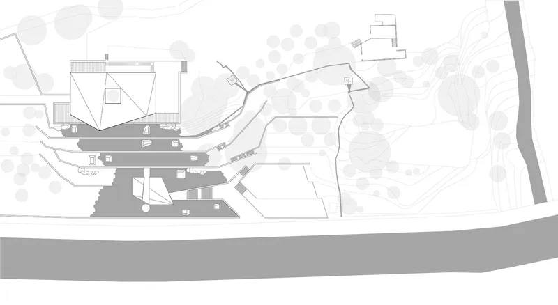 Site plan drawing showing building footprints terraced along a curved riverbank with surrounding topography