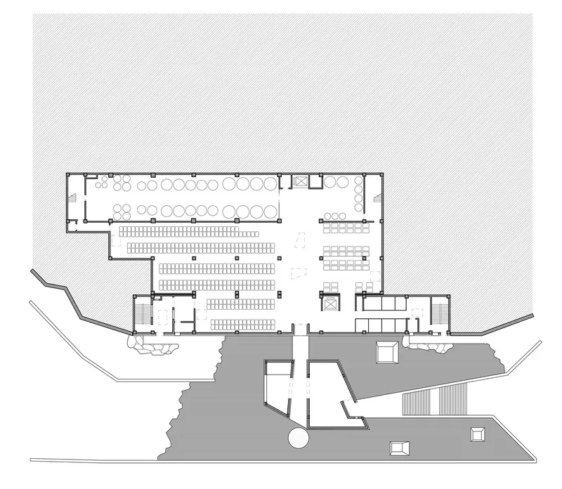 Floor plan drawing showing auditorium seating and terraced outdoor platforms with surrounding landscape