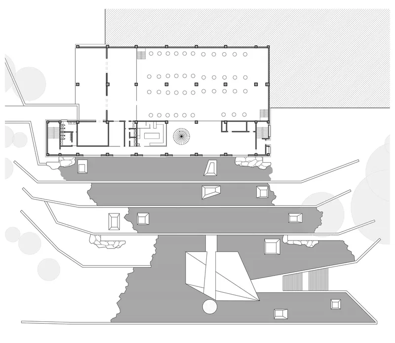 Floor plan drawing showing flexible seating layout with central circular feature and stepped terraces below