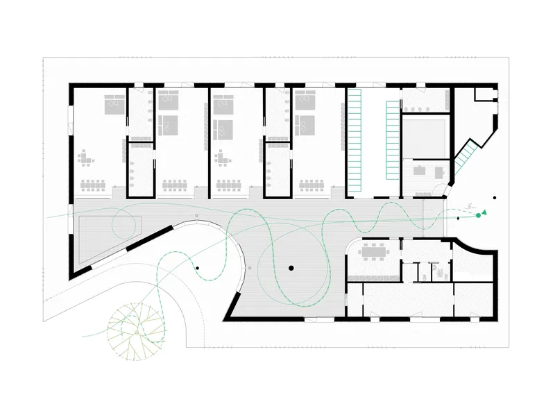 Floor plan drawing showing four classroom spaces along one edge and a central circulation zone with curved pathways