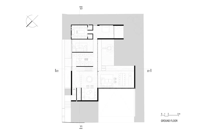 Ground floor plan showing living and dining spaces arranged around a central staircase