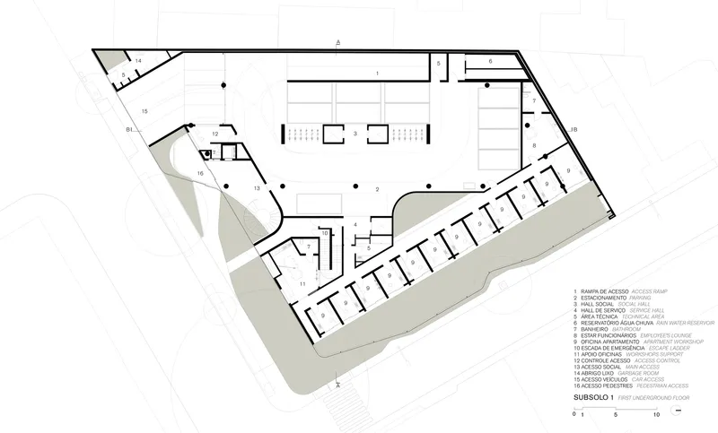 Floor plan drawing showing first underground level with parking, service areas, and angled building perimeter