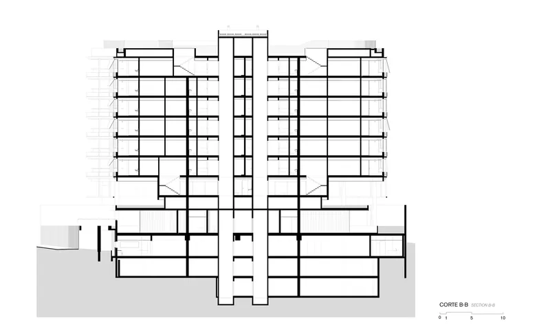 Section drawing revealing the full height of two residential towers connected by a central vertical circulation core