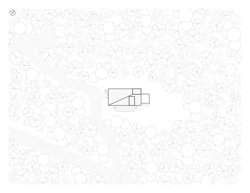 Site plan drawing with building footprint centered among stylized tree canopy circles