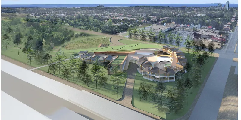 An aerial view of Children’s City reveals a nature-integrated school campus designed around courtyards, green roofs, and community spaces.