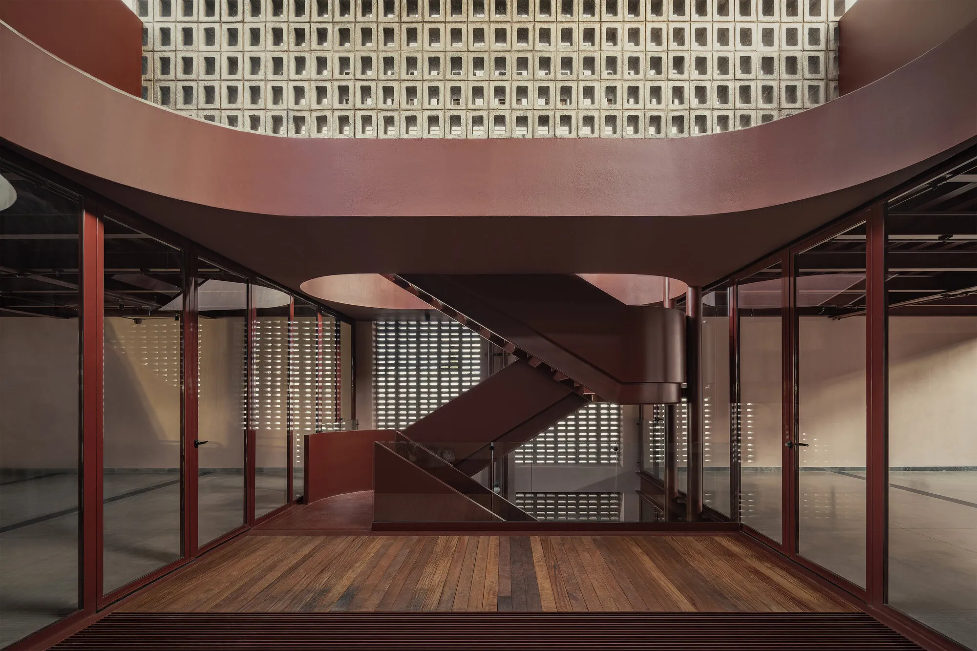 REIMS 502 Stacks a Pink Commercial Building Around Courtyards and Vaults in Querétaro