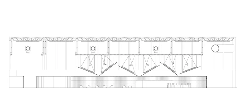 Section drawing revealing exposed truss roof structure above interior spaces with circular openings