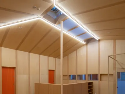 D.A Scatters a Village of Gabled Rooms Across a Family Support Center in Kofu
