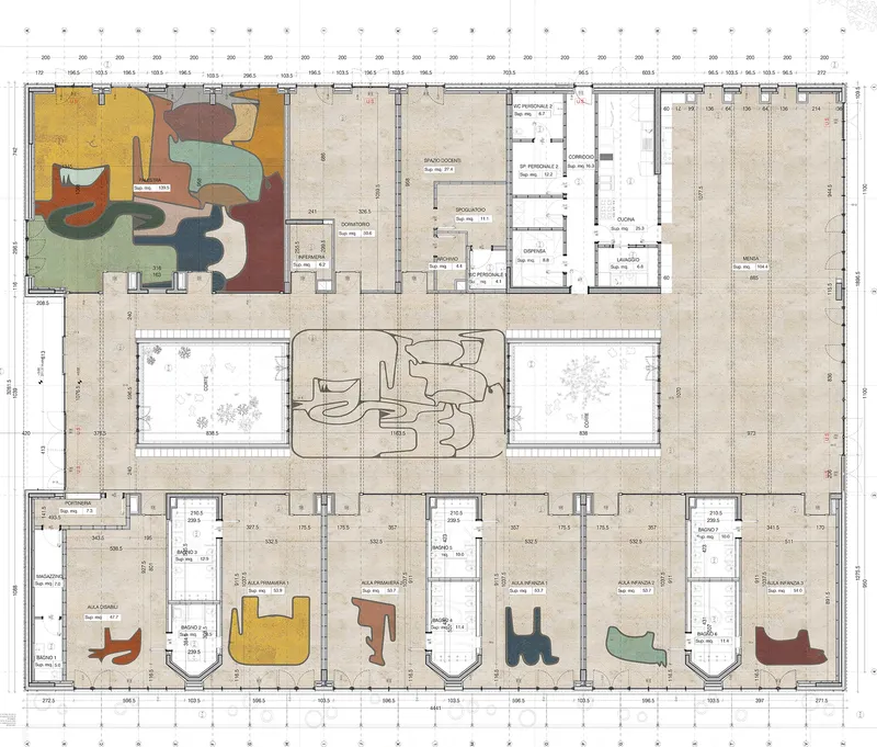 Floor plan drawing with color-coded organic forms indicating furniture or equipment within classroom spaces