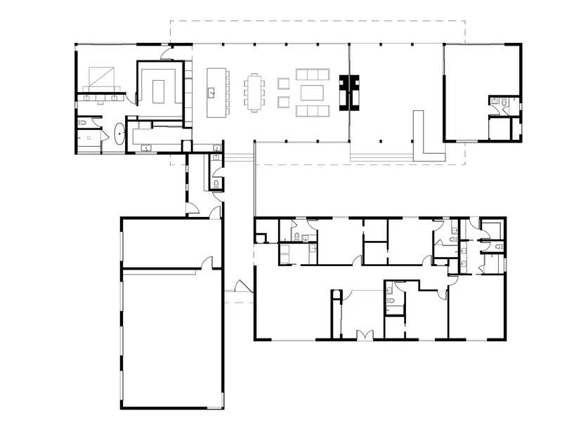 Floor plan drawing showing an open living area connected to private bedroom wing and garage volume
