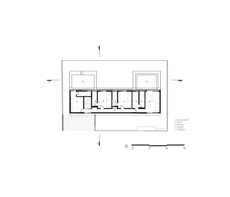 Floor plan showing a linear arrangement of rooms with two courtyards flanking the central spaces