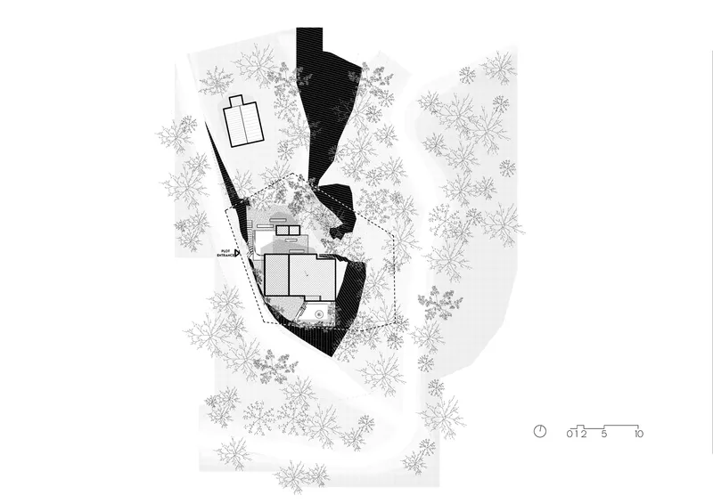 Site plan drawing showing building footprint and terrace amid sketched trees on sloping terrain