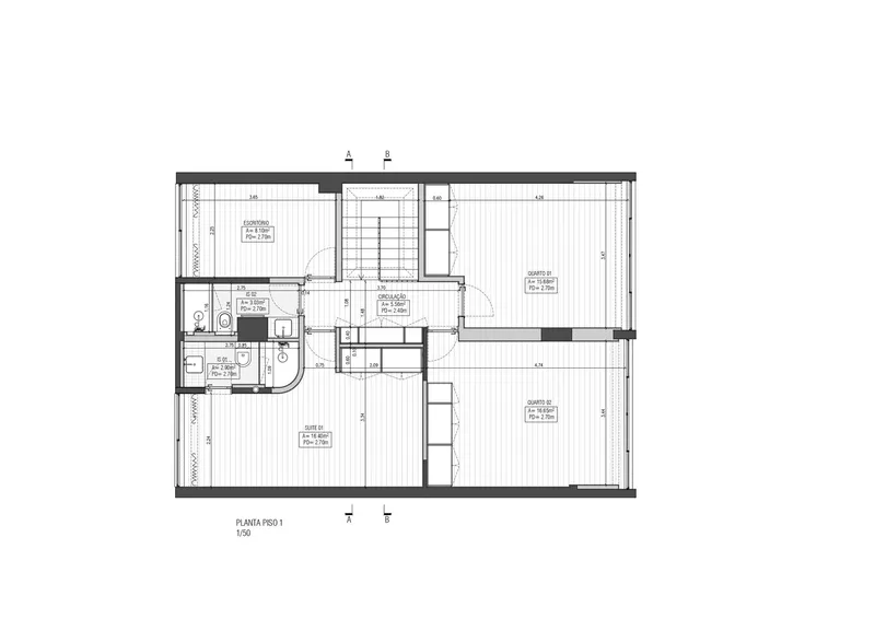 Floor plan drawing showing a residential unit with central staircase, two bedrooms, and bathroom