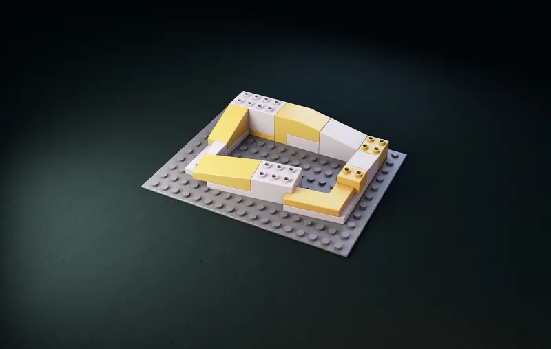 Isometric model showing a courtyard plan with yellow and white building blocks arranged around central space