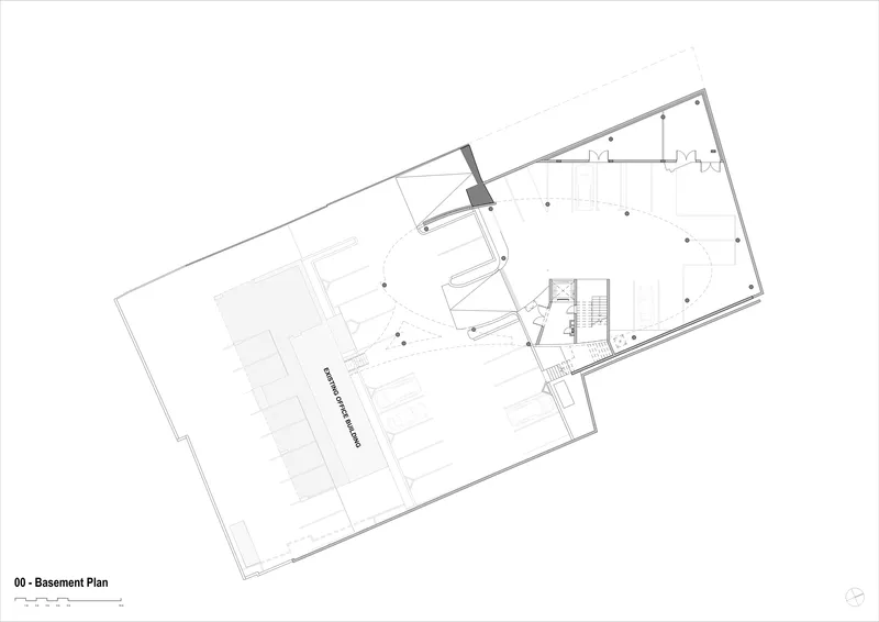 Basement plan drawing depicting parking area, central stair core, and service spaces within trapezoidal footprint