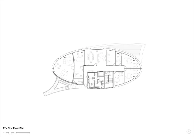 First floor plan drawing illustrating open office layout within curved perimeter and central core grouping