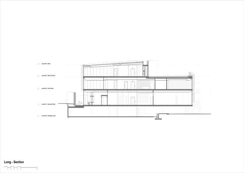 Longitudinal section drawing revealing four levels including parking below grade and roof terrace above