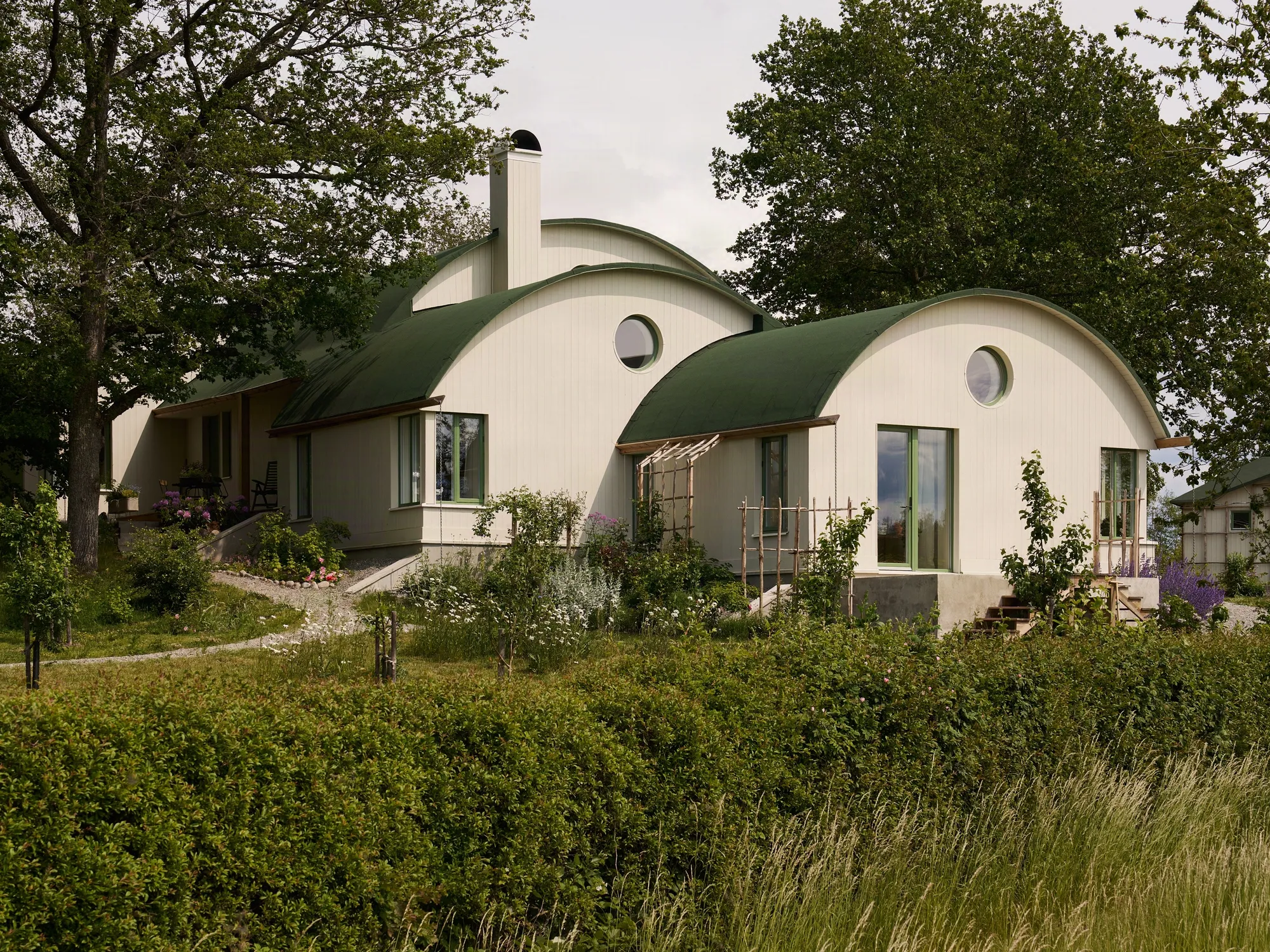 Strombro Building Workshop Sculpts a Trio of Barrel Vaults for an Artist's House on a Swedish Hillside