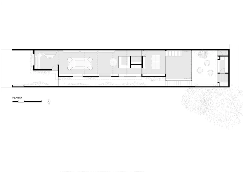 Floor plan drawing showing a narrow linear layout with interior rooms and an exterior courtyard