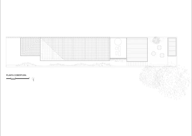 Roof plan drawing showing the long rectangular volume with textured surfaces and planted areas