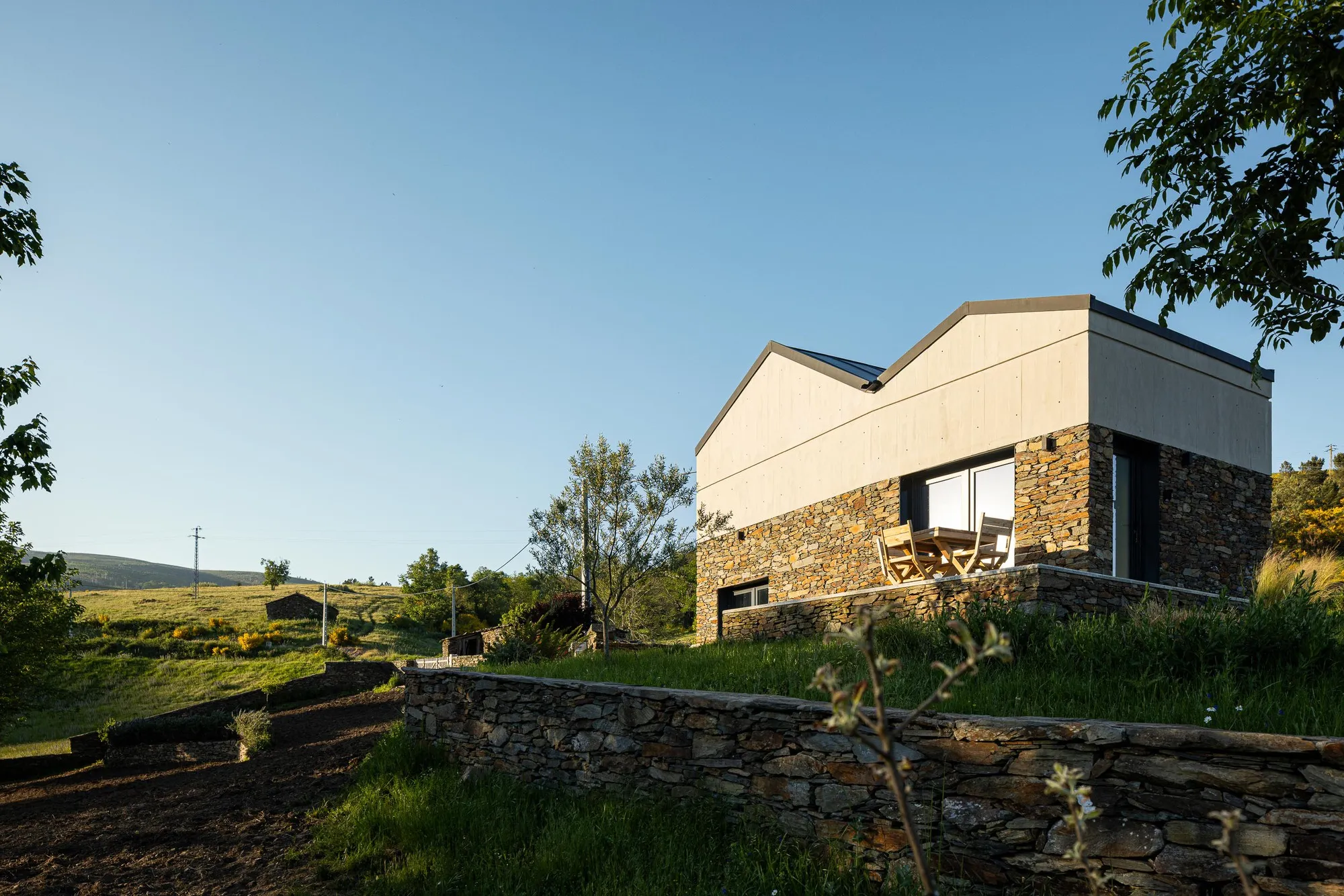 Atelier DRK Grafts a Cantilevered Timber Volume onto Stone Ruins in Serra da Estrela