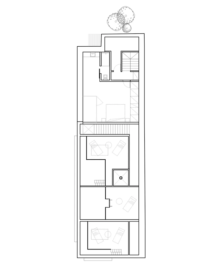 Upper floor plan drawing showing living spaces arranged across multiple levels with skylights