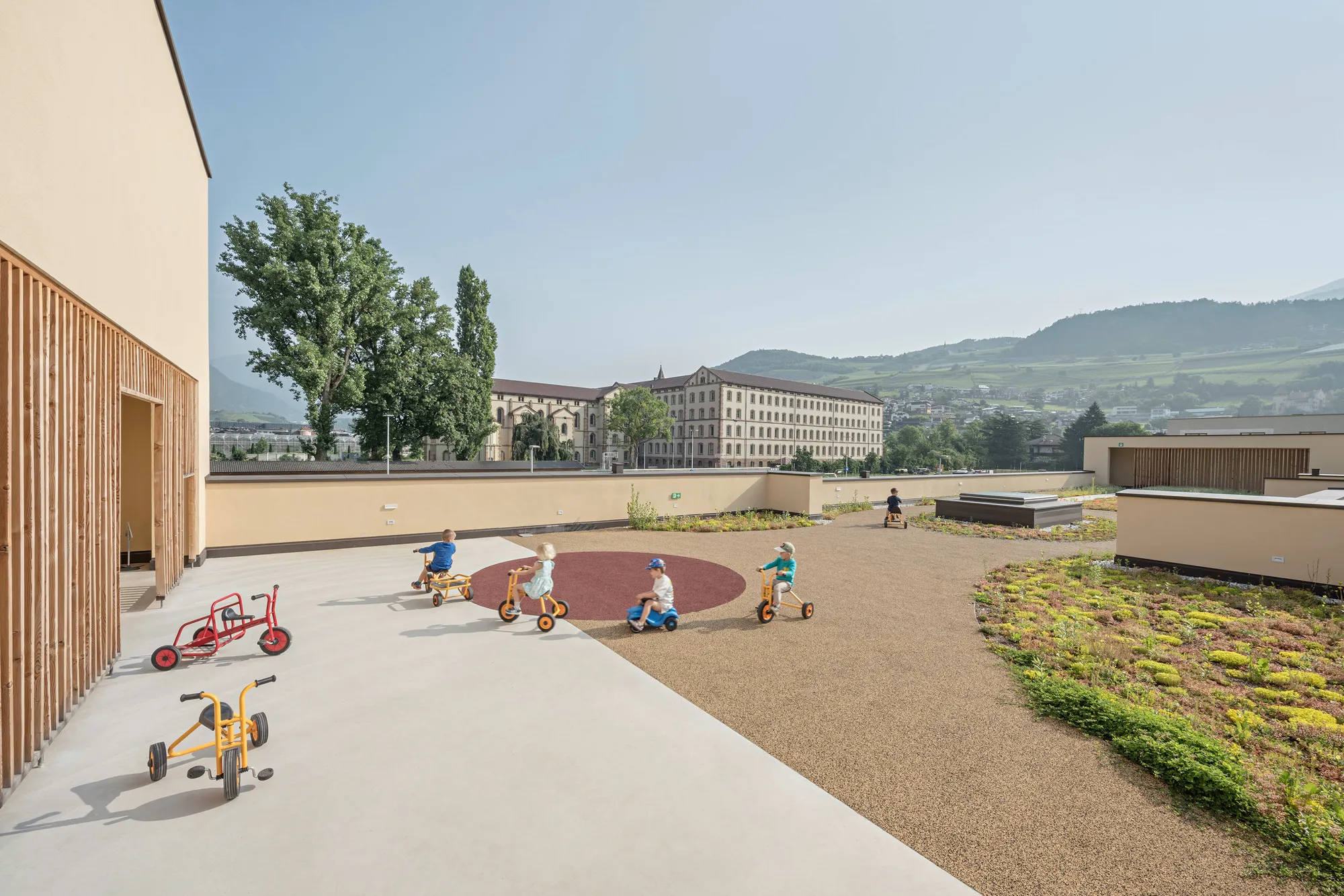 feld72 Designs a Kindergarten in Brixen Where Rooms Flow Like a Village Street