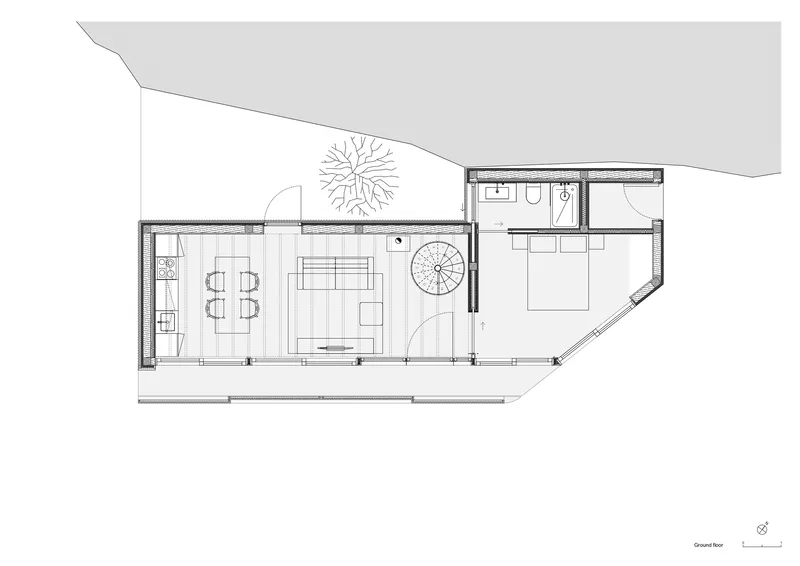 Ground floor plan showing open living and dining area with spiral stair and courtyard
