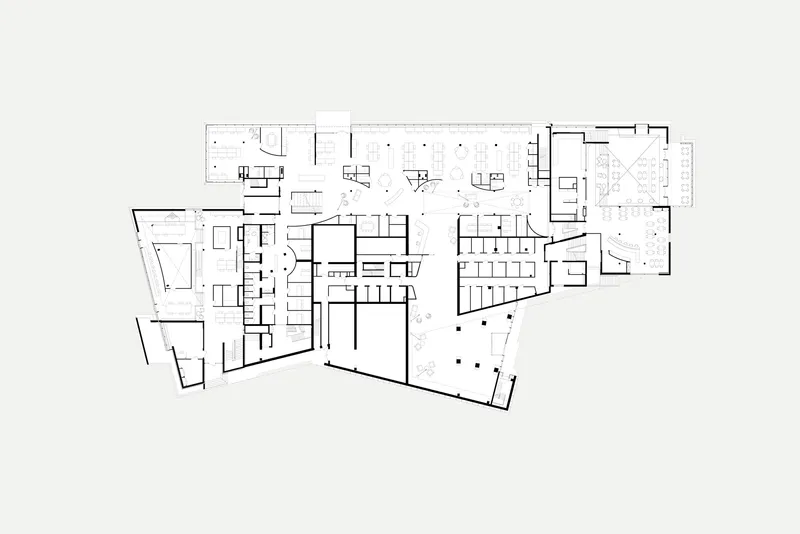 Floor plan drawing revealing a large central hall flanked by smaller rooms and angled wings