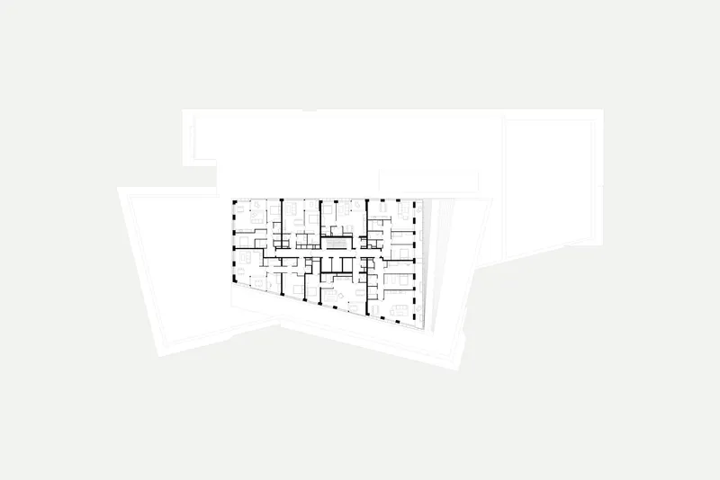 Floor plan drawing depicting residential units organized along a central corridor with exterior terraces