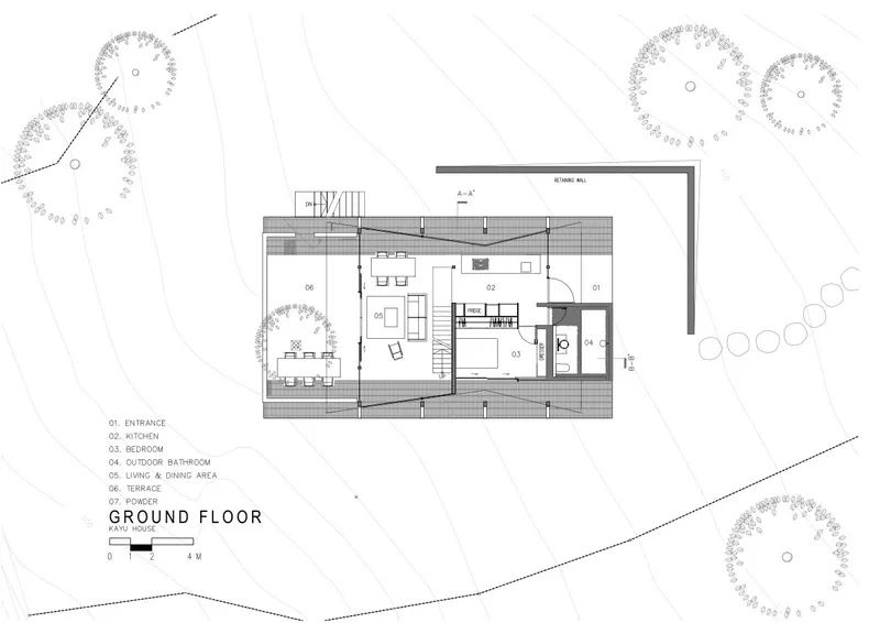 Ground floor plan drawing showing living spaces, kitchen, and covered deck surrounding the A-frame volume