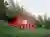 Architektura Sinks a Red Steel Villa into a Bohemian Forest Slope
